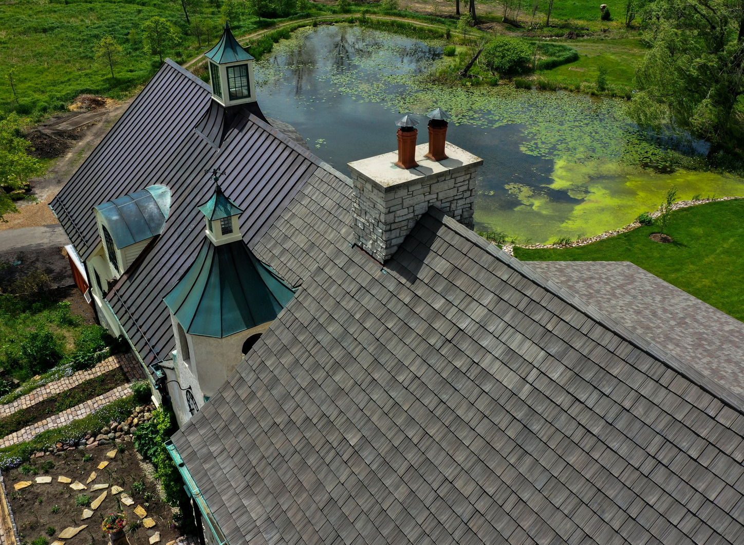 metal roofing next to brava shake